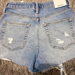High waisted light washed denim shorts.